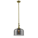 Bell Mini Pendant shown in the Antique Brass finish with a Plated Smoke shade