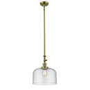 Bell Mini Pendant shown in the Antique Brass finish with a Seedy shade