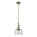 Bell Mini Pendant shown in the Antique Brass finish with a Seedy shade