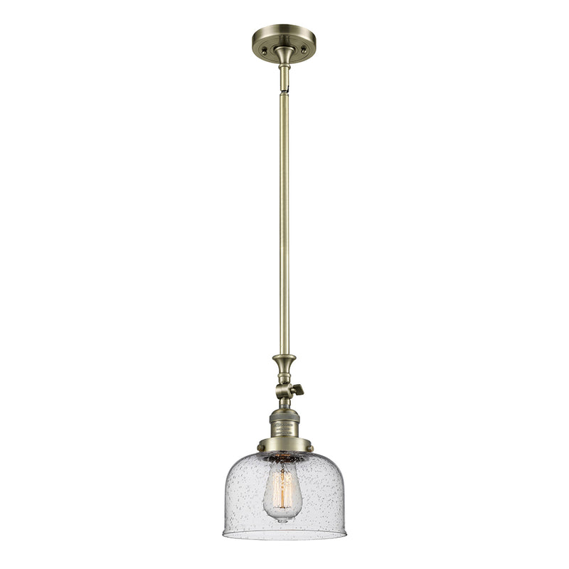 Bell Mini Pendant shown in the Antique Brass finish with a Seedy shade