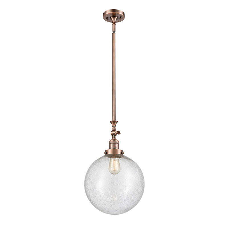 Beacon Mini Pendant shown in the Antique Copper finish with a Seedy shade