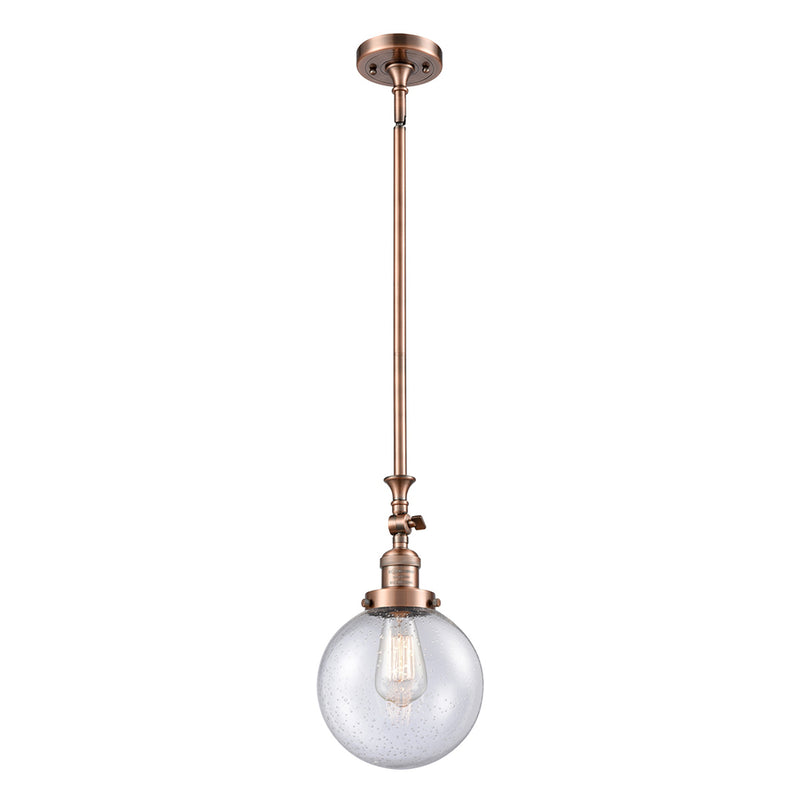 Beacon Mini Pendant shown in the Antique Copper finish with a Seedy shade