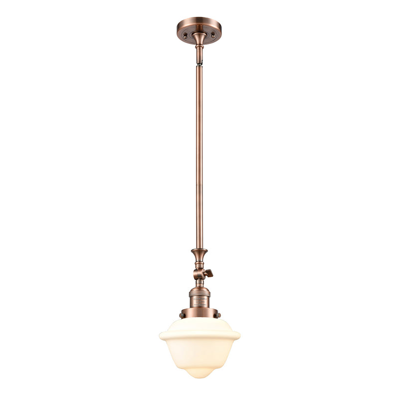 Oxford Mini Pendant shown in the Antique Copper finish with a Matte White shade