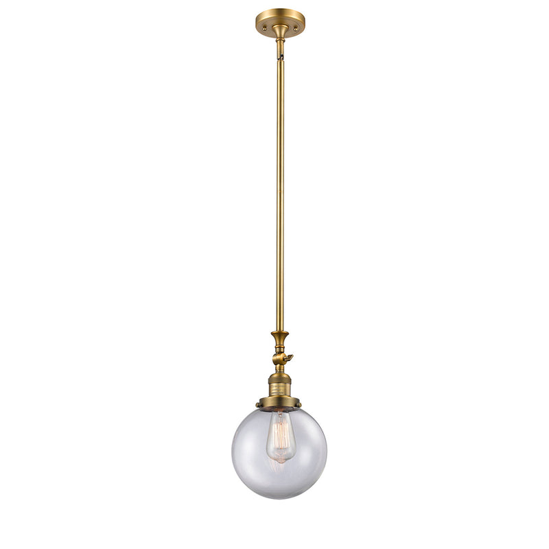 Beacon Mini Pendant shown in the Brushed Brass finish with a Clear shade