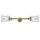 Canton Bath Vanity Light shown in the Antique Brass finish with a Clear shade