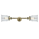 Canton Bath Vanity Light shown in the Antique Brass finish with a Clear shade