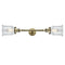Canton Bath Vanity Light shown in the Antique Brass finish with a Clear shade