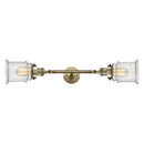Canton Bath Vanity Light shown in the Antique Brass finish with a Seedy shade