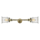 Canton Bath Vanity Light shown in the Antique Brass finish with a Seedy shade
