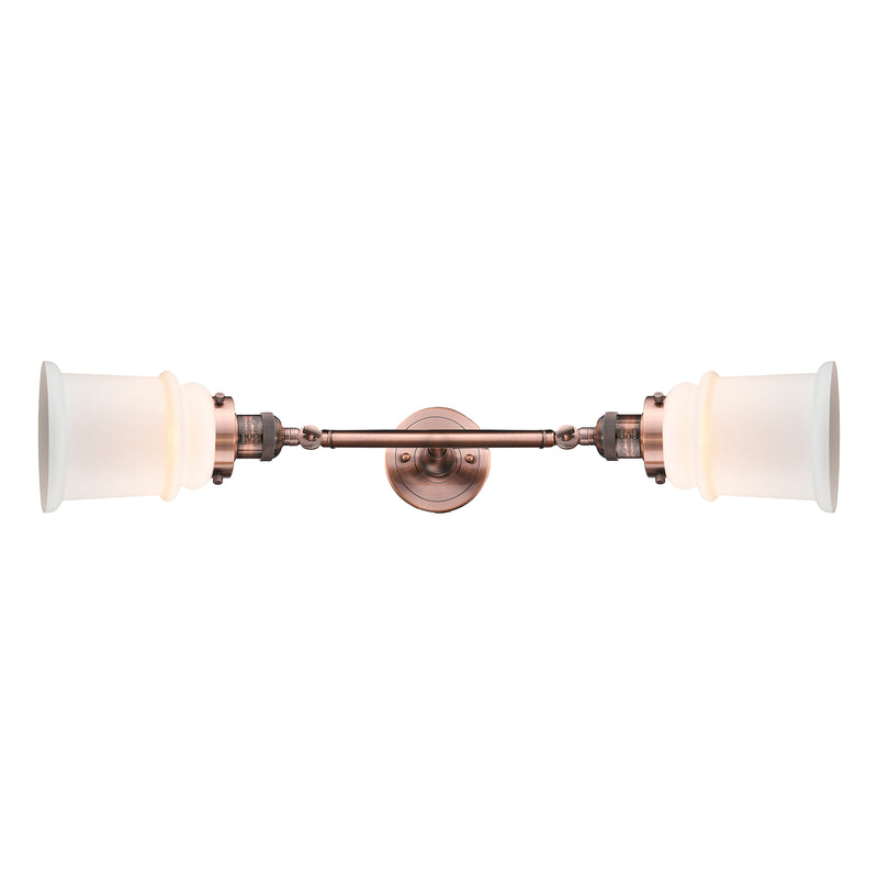 Canton Bath Vanity Light shown in the Antique Copper finish with a Matte White shade