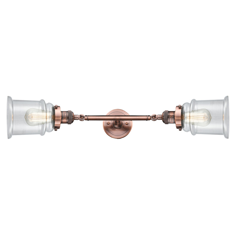 Canton Bath Vanity Light shown in the Antique Copper finish with a Clear shade