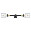 Canton Bath Vanity Light shown in the Black Antique Brass finish with a Clear shade