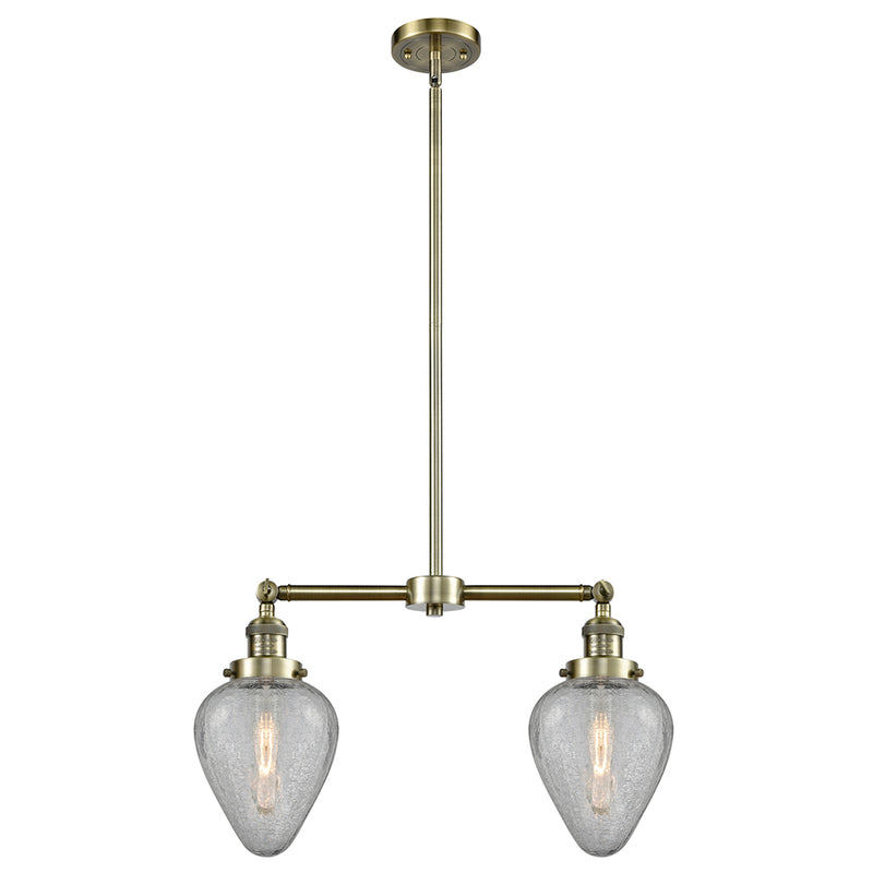 Geneseo Island Light shown in the Antique Brass finish with a Clear Crackled shade