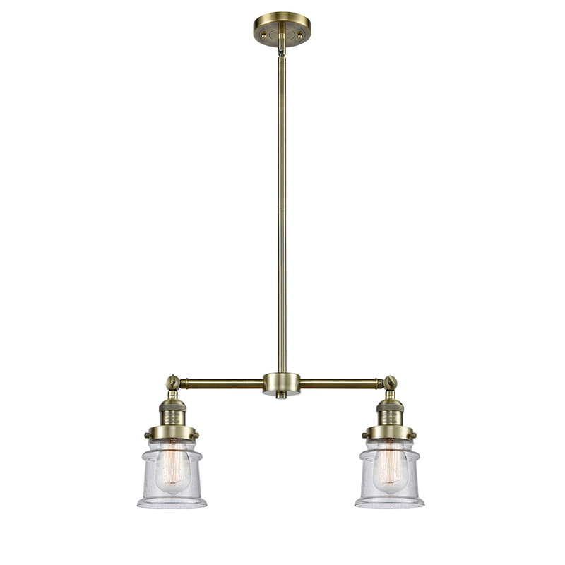 Canton Island Light shown in the Antique Brass finish with a Seedy shade