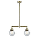 Beacon Island Light shown in the Antique Brass finish with a Seedy shade