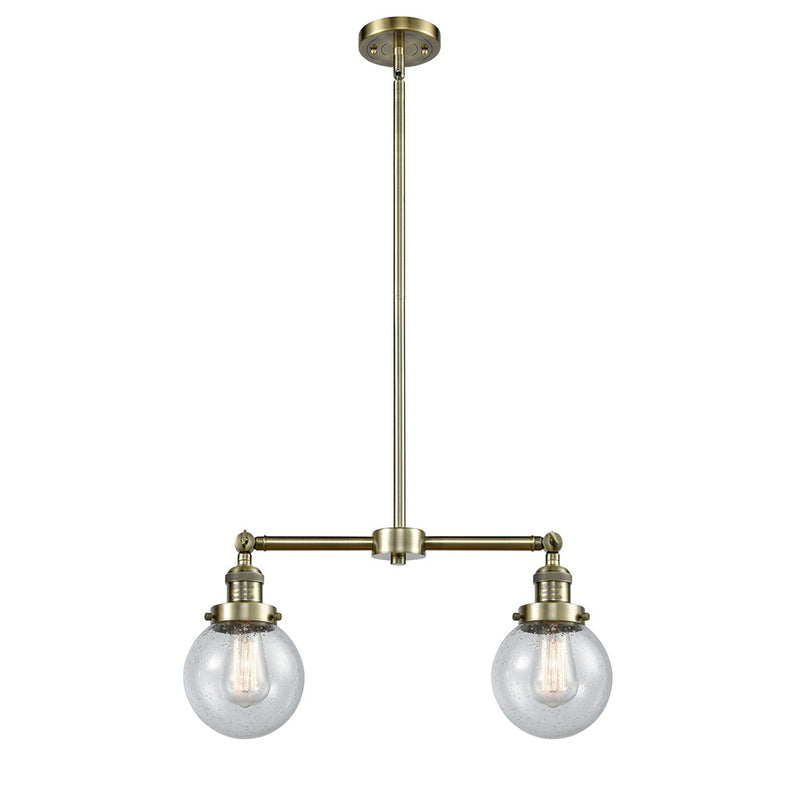 Beacon Island Light shown in the Antique Brass finish with a Seedy shade