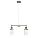 Dover Island Light shown in the Antique Brass finish with a Seedy shade