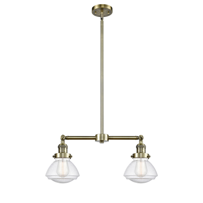 Olean Island Light shown in the Antique Brass finish with a Seedy shade