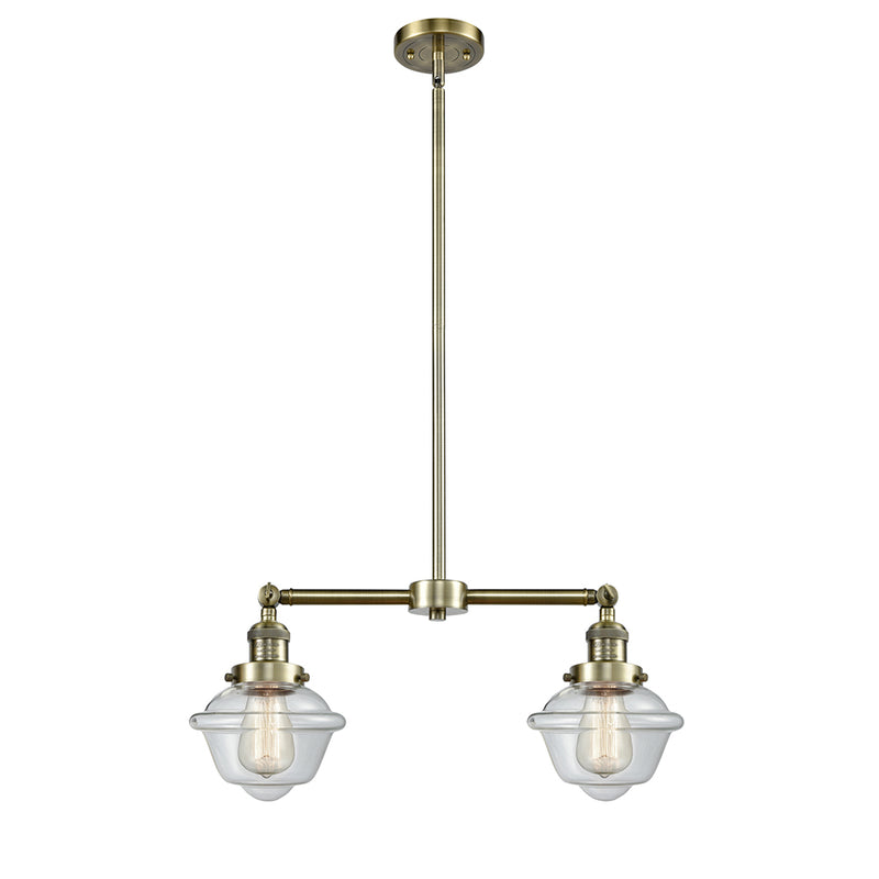 Oxford Island Light shown in the Antique Brass finish with a Clear shade