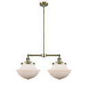 Oxford Island Light shown in the Antique Brass finish with a Matte White shade