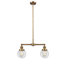 Beacon Island Light shown in the Brushed Brass finish with a Clear shade