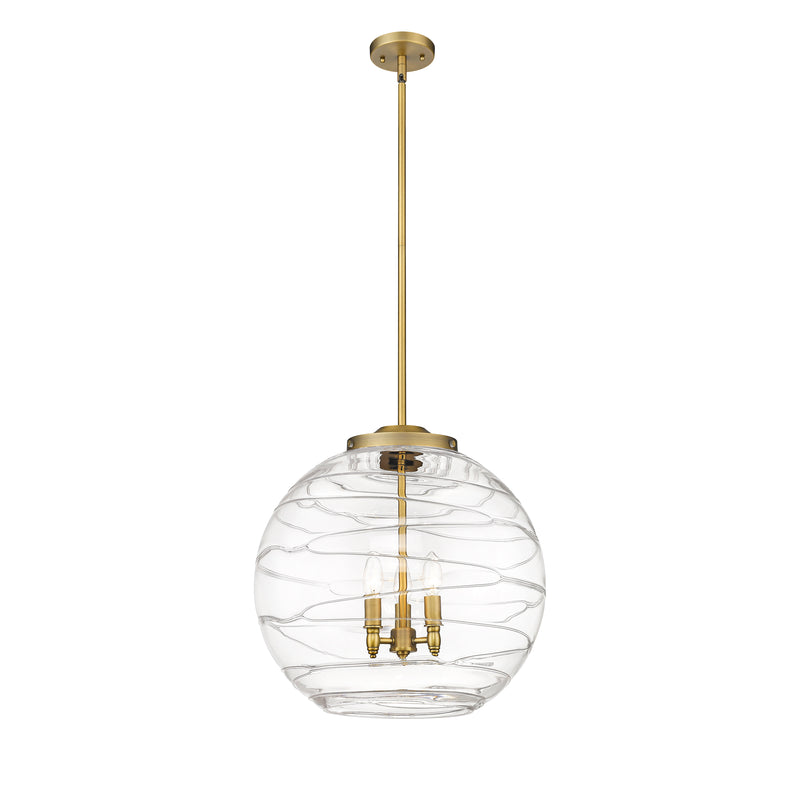 Deco Swirl Pendant shown in the Brushed Brass finish with a Clear shade