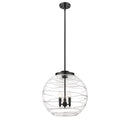 Deco Swirl Pendant shown in the Matte Black finish with a Clear shade