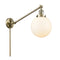 Beacon Swing Arm shown in the Antique Brass finish with a Matte White shade