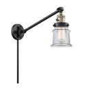Canton Swing Arm shown in the Black Antique Brass finish with a Clear shade