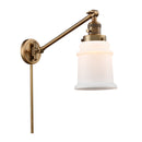 Canton Swing Arm shown in the Brushed Brass finish with a Matte White shade