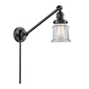 Canton Swing Arm shown in the Matte Black finish with a Clear shade