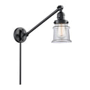 Canton Swing Arm shown in the Matte Black finish with a Clear shade