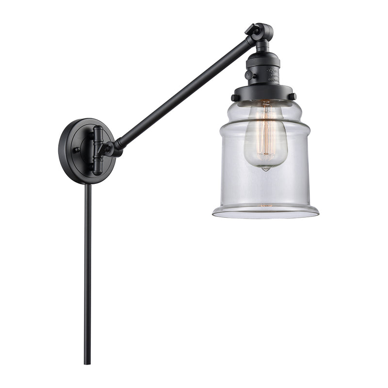 Canton Swing Arm shown in the Matte Black finish with a Clear shade