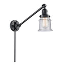 Canton Swing Arm shown in the Matte Black finish with a Seedy shade