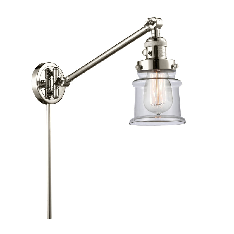 Canton Swing Arm shown in the Polished Nickel finish with a Clear shade