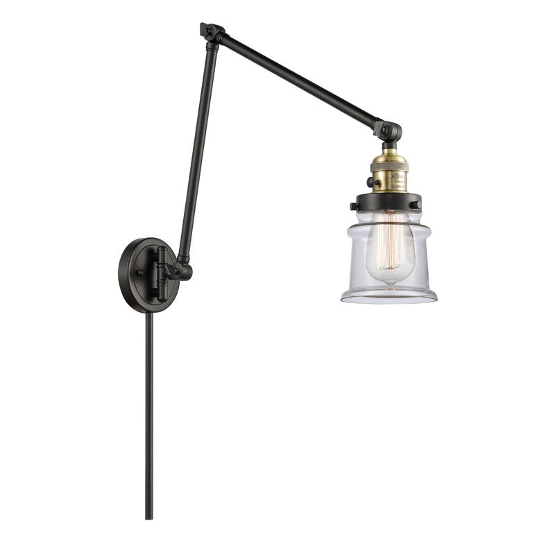 Canton Swing Arm shown in the Black Antique Brass finish with a Clear shade