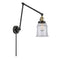 Canton Swing Arm shown in the Black Antique Brass finish with a Clear shade
