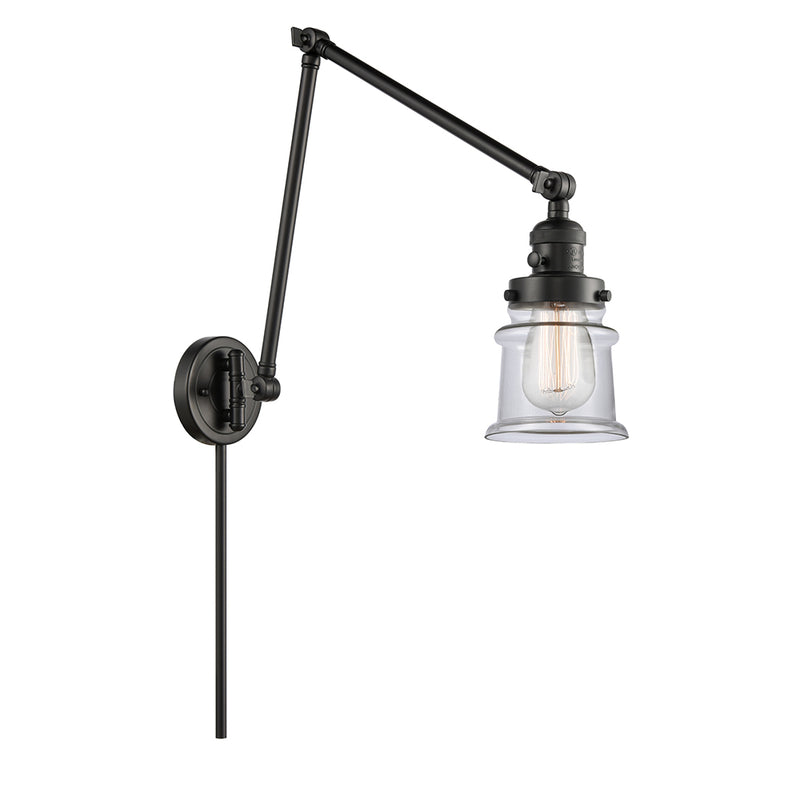 Canton Swing Arm shown in the Matte Black finish with a Clear shade
