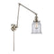 Canton Swing Arm shown in the Polished Nickel finish with a Clear shade