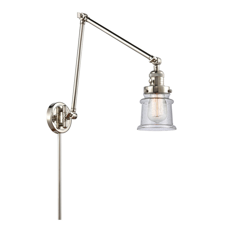 Canton Swing Arm shown in the Polished Nickel finish with a Seedy shade