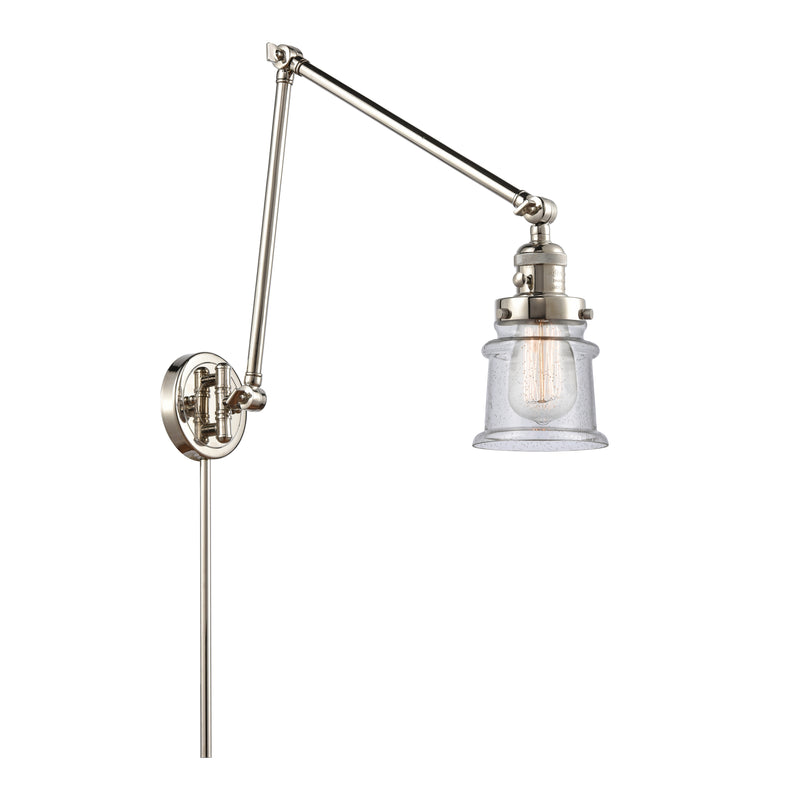 Canton Swing Arm shown in the Polished Nickel finish with a Seedy shade