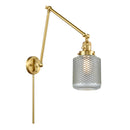 Stanton Swing Arm shown in the Satin Gold finish with a Clear Wire Mesh shade