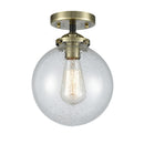 Beacon Semi-Flush Mount shown in the Black Antique Brass finish with a Seedy shade