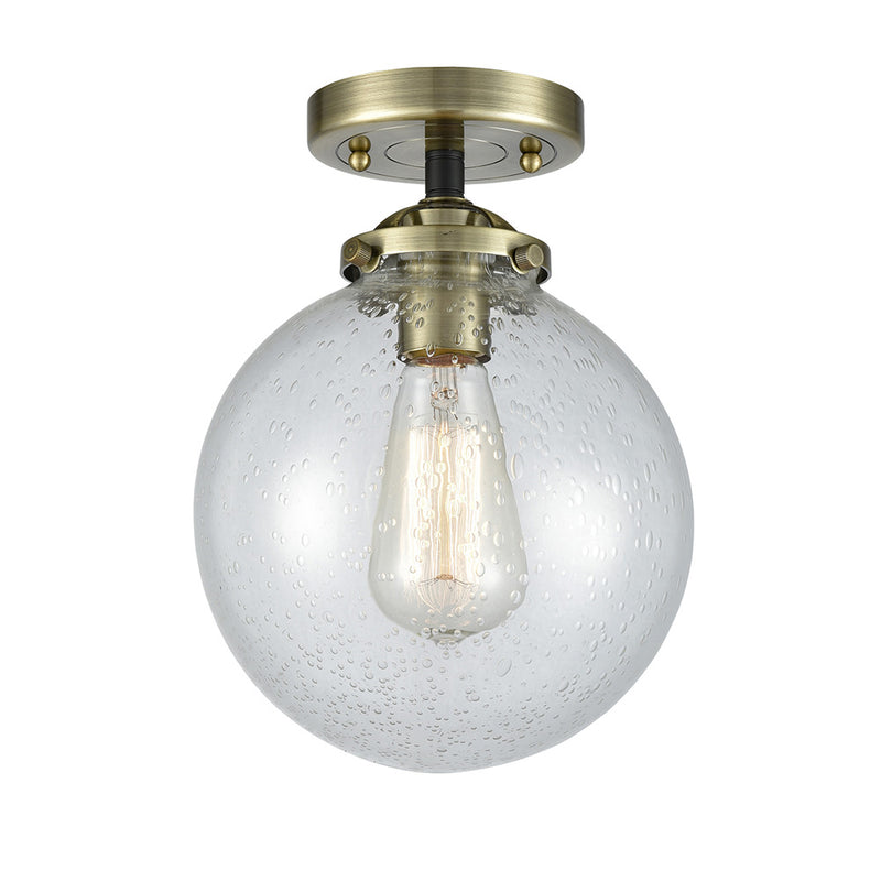 Beacon Semi-Flush Mount shown in the Black Antique Brass finish with a Seedy shade