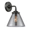 Cone Sconce shown in the Oil Rubbed Bronze finish with a Plated Smoke shade