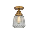 Chatham Semi-Flush Mount shown in the Brushed Brass finish with a Clear shade