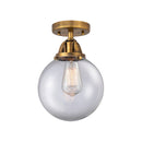 Beacon Semi-Flush Mount shown in the Brushed Brass finish with a Clear shade