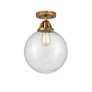 Beacon Semi-Flush Mount shown in the Brushed Brass finish with a Seedy shade