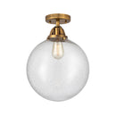 Beacon Semi-Flush Mount shown in the Brushed Brass finish with a Seedy shade