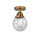 Beacon Semi-Flush Mount shown in the Brushed Brass finish with a Seedy shade